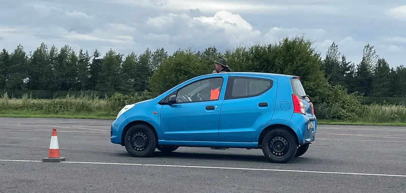 Blue hatchback at an autotest