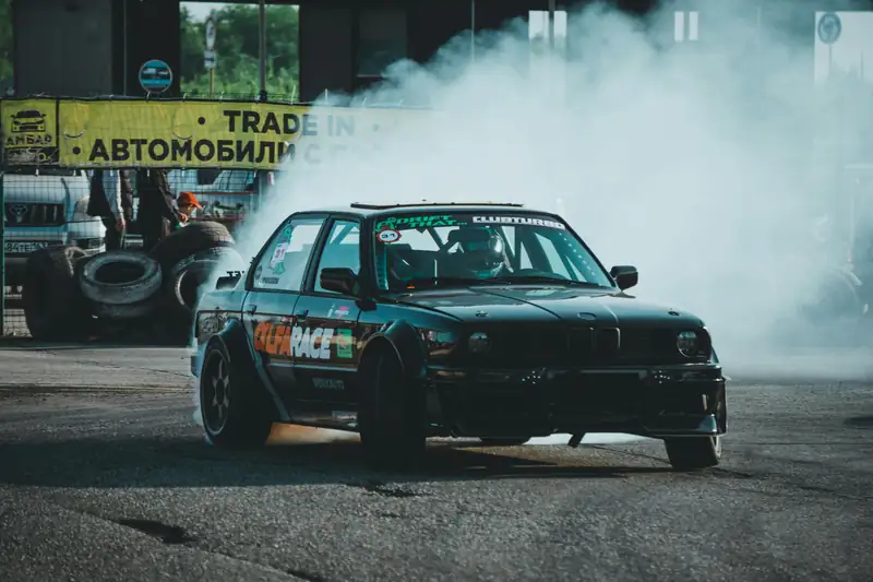 BMW drifting through thick tyre smoke