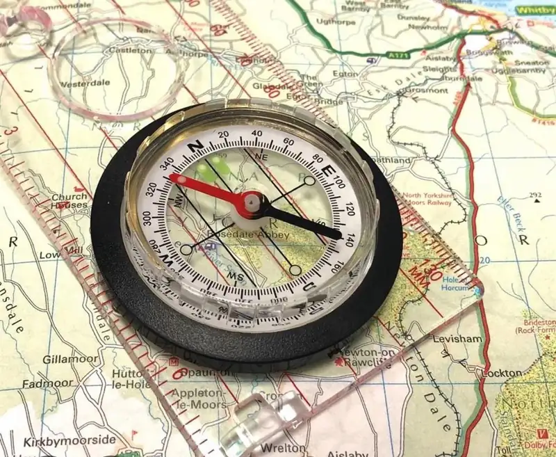 Compass resting on an Ordnance Survey map